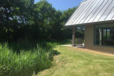 Aan Noordzee-vakantiehuis-villa veranda-tuin